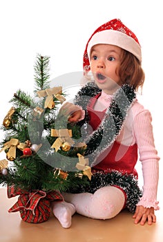 Girl with new-year tree.