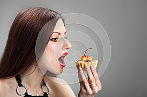 Girl nibbling the cake