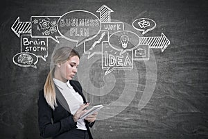 Girl with notebook and business plan