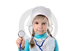 Girl nurse in white uniform with stethoscope in the ears. Holding stethoscope on the foreground. Landscape