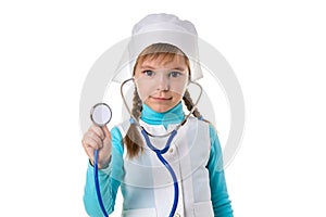 Girl nurse in white uniform with stethoscope in the ears. Listens holding stethoscope on the foreground, distant