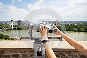 Girl on the observation deck, view of the city. Bratislava castle.