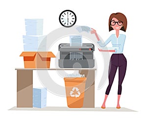 Girl office worker works with Shredder, terminates a pack of documents. Compact shredder stands on the table with a box of stacked