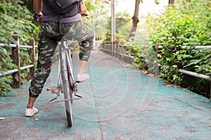 The girl on old bike on the bike lane