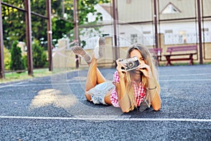 Girl with old camera - outdoor