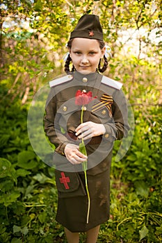 Girl in old military uniform on may 9.