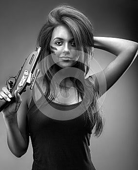 Girl with an old pistol in her hand