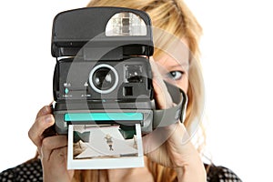 Girl with old point and shoot instant camera