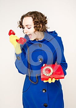 Girl with old red telephone