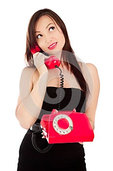 Girl with old red telephone