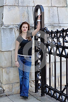 Girl with old stone wall in background