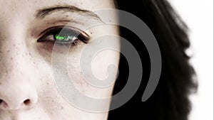 Girl opening her eye to reveal green scrolling data