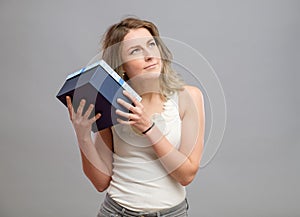 Girl opening a present isolated