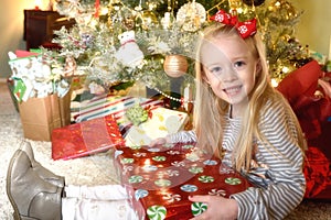 Girl opening presents