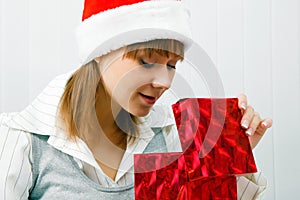 Girl opens a Christmas present