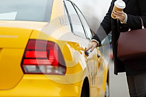 Girl opens door of taxi