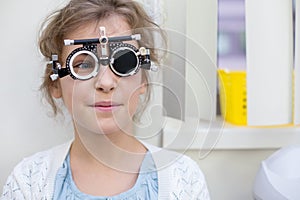 girl in ophthalmic glasses in medical photo