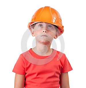 Girl in an orange helmet looking up