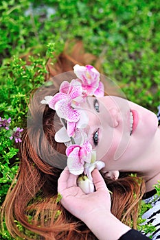 Girl with orchid in hair photo