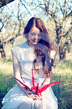 Girl with origami crane