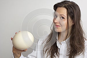 Girl with ostrich egg