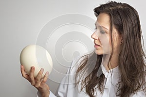 Girl with ostrich egg