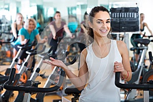 girl and other females working out in sport club