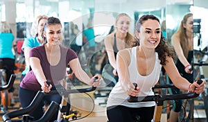 Girl and other females working out in sport club