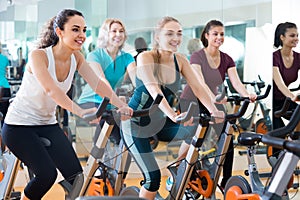 Girl and other females working out in sport club