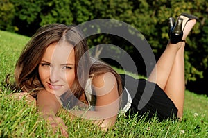 Girl outdoors lying on the grass