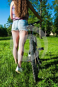 Girl outgoing with her bicycle