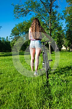 Girl outgoing with her bicycle