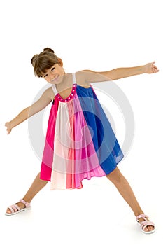 Girl with outstretched arms and legs wide apart