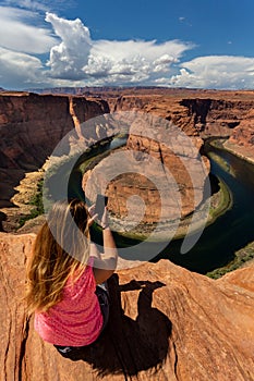 Girl overlooking Horse Shoe Bend landscape, Arizona, United States