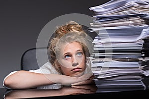 Girl overwhelmed by paperwork