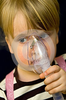 Girl with oxygen mask