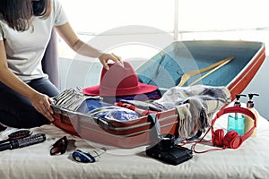girl packing the luggage prepare for her trip
