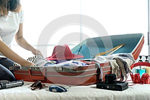 girl packing the luggage prepare for her trip