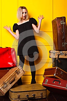 Girl packs suitcases for a vacation trip