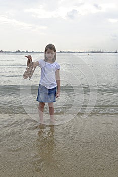 Girl paddling in the sea photo