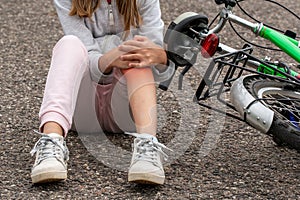 Girl in pain after a bicycle accident