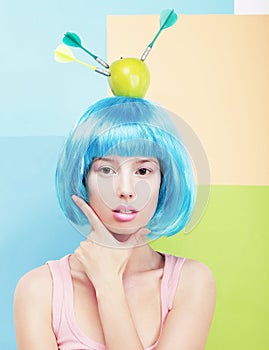 Girl with Painted Blue Hairs and Apple on Head