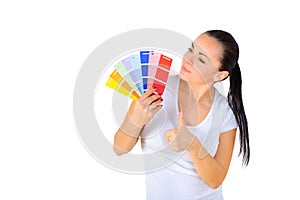 Girl painter chooses the color of paint to repair the room