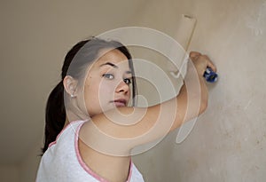 Girl painting apartment