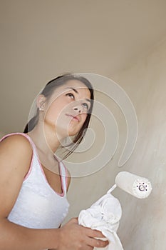 Girl painting apartment