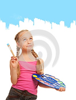 Girl painting with blue paint