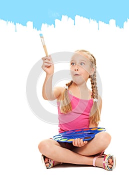 Girl painting with blue paint