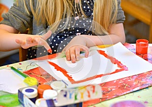 Girl painting with finger