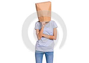 Girl with paper bag over head
