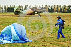 Girl, parachute and aircraft